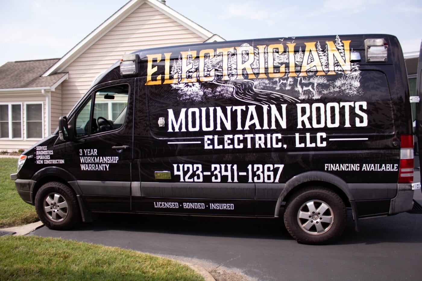 A black electrician van with